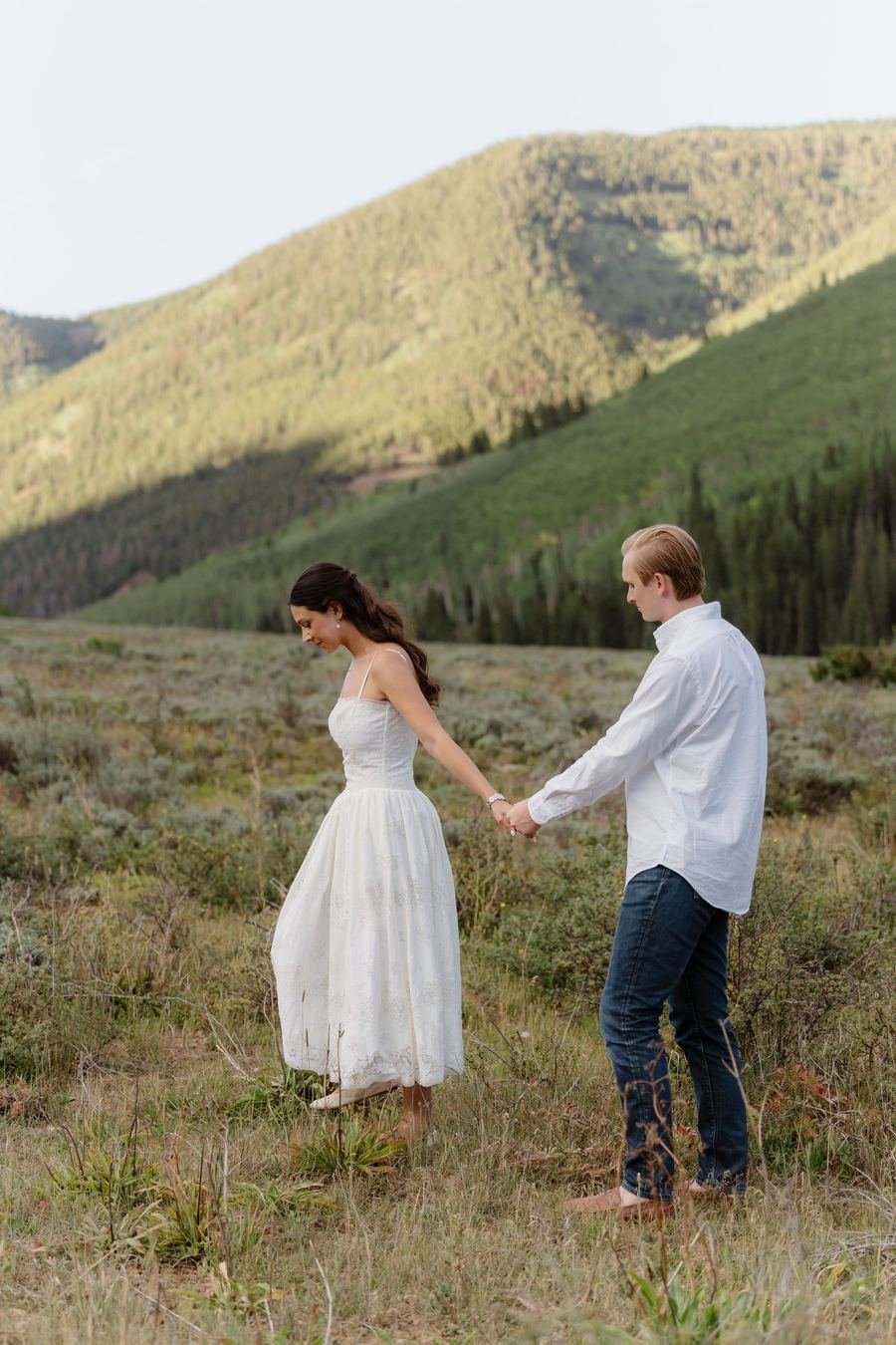 Valeria and Zachary walking hand in hand